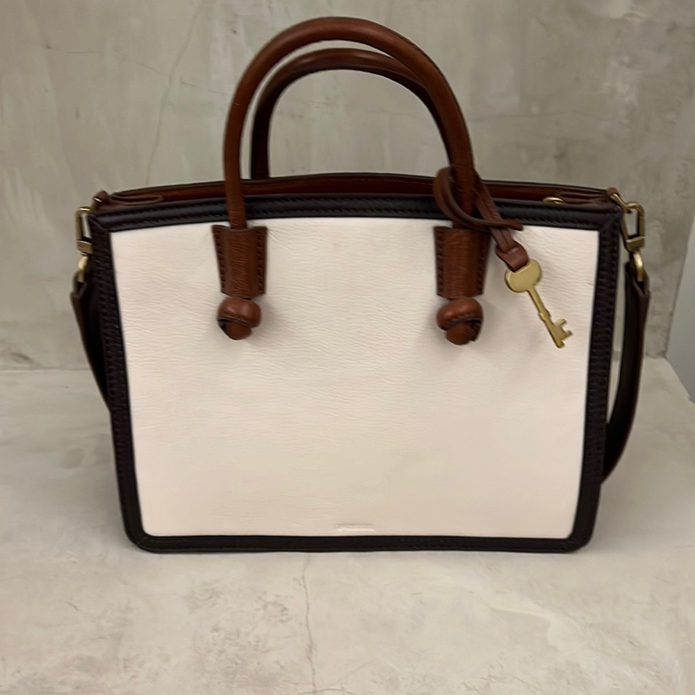 Brown and off white Fossil purse.